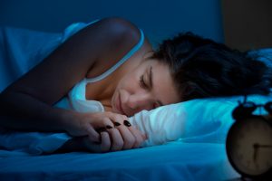 sleeping woman in a dark room