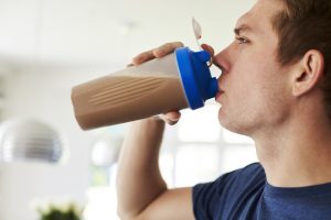 man drinking protein shake