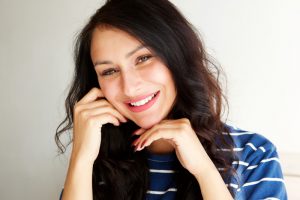 beautiful woman smiling with white teeth and glowing skin