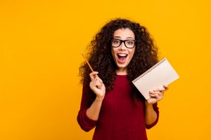 Portrait of her she nice cute attractive cheerful cheery amazed wavy-haired lady great idea article news academic a-mark isolated over bright vivid shine background