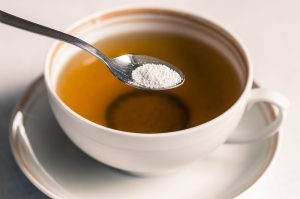 Tea with sweetener in a spoon