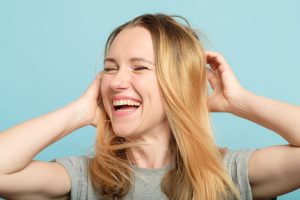 happy woman playing hair beauty confidence