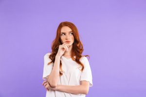 Portrait of a pensive young girl standing