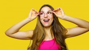 Funny portrait of excited girl wearing glasses eyewear. Closeup