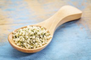 hemp seed hearts on wooden spoon